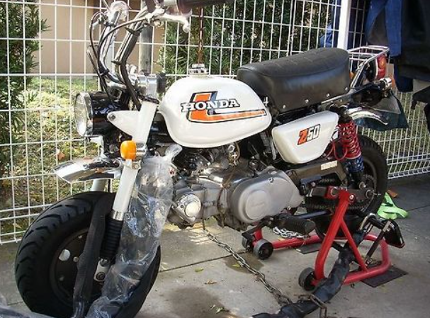 Honda motorcycle on a lift with a white background