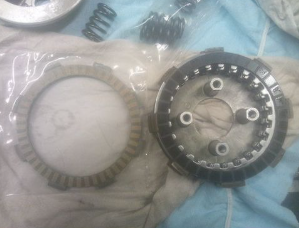 Mechanical clutch components on a blue and gray background