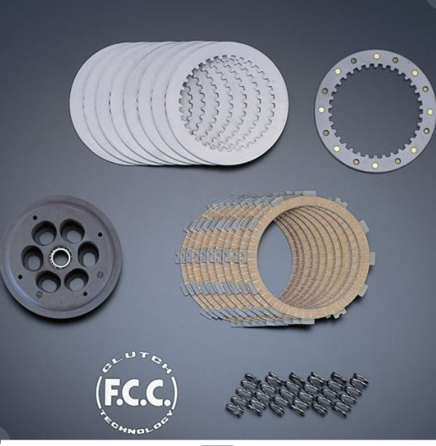 Clutch components set on a gray background with F.C.C. Clutch Technologies logo.