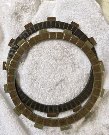 Clutch plate on a white textured background