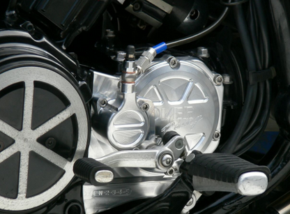 Close-up of a motorcycle engine and wheel