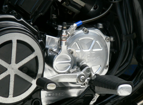 Close-up of a motorcycle engine and wheel