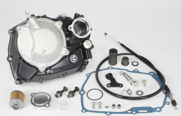 Motorcycle engine parts laid out on a white background