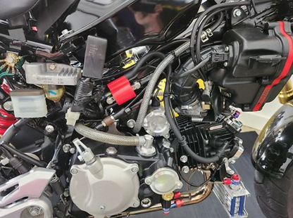 Close-up of a motorcycle engine with visible branding