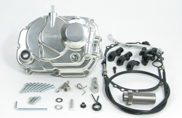 Motorcycle transmission kit with various parts on a white background