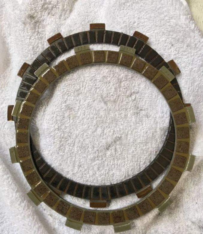 Clutch plate on a textured white background