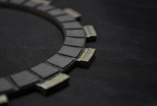 Close-up of a clutch plate on a black background