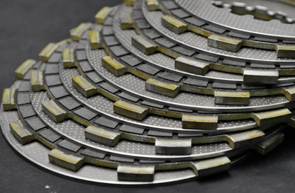 Stack of brake pads on a dark background