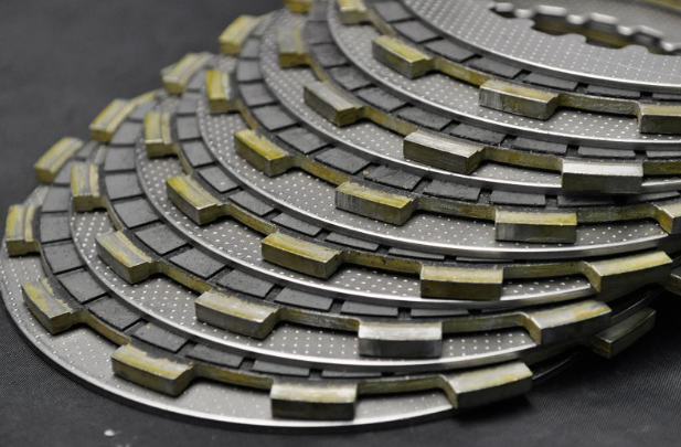 Stack of brake pads on a dark background