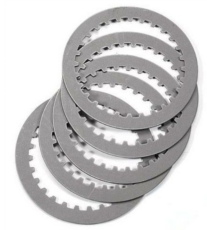 Stack of metallic clutch plates on a white background