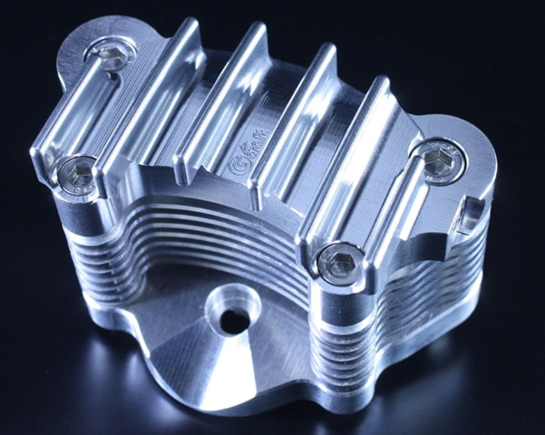 Metallic engine part on a black background