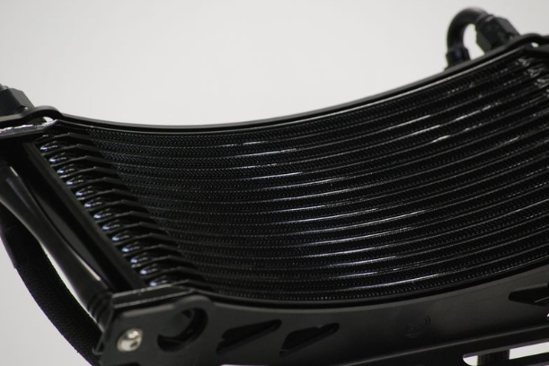 Close-up of a black radiator with a white background