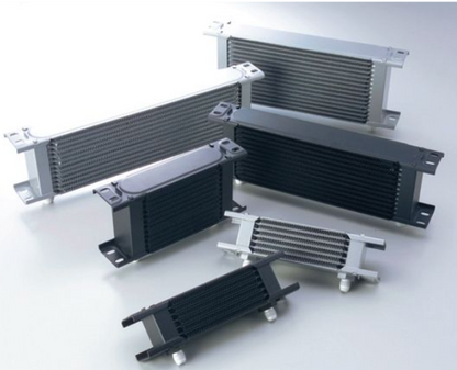 Collection of metal heat exchangers on a white background