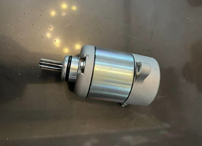 Metallic motor on a reflective surface
