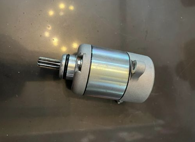 Metallic motor on a reflective surface