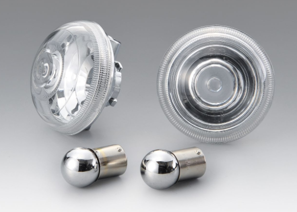 Two metallic light bulbs and two socket bases on a gray background