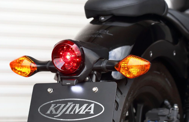 Close-up of a motorcycle's rear lights and Kijima branding.