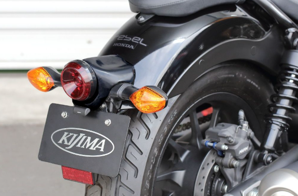 Motorcycle with KJIMA license plate on a blurred background