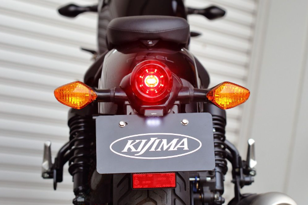 Close-up of a motorcycle with KIJIMA branding on a white background