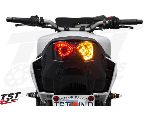 Motorcycle rearview with visible branding on a white background