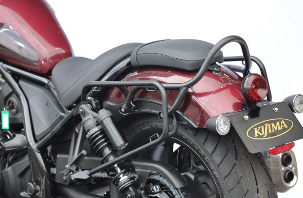Close-up of a red motorcycle with KIJIMA branding on a blurred background