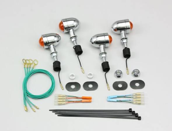 Set of motorcycle lights and wiring harnesses on a white background