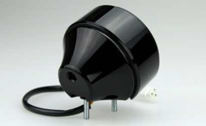 Black cylindrical electronic component on a white background