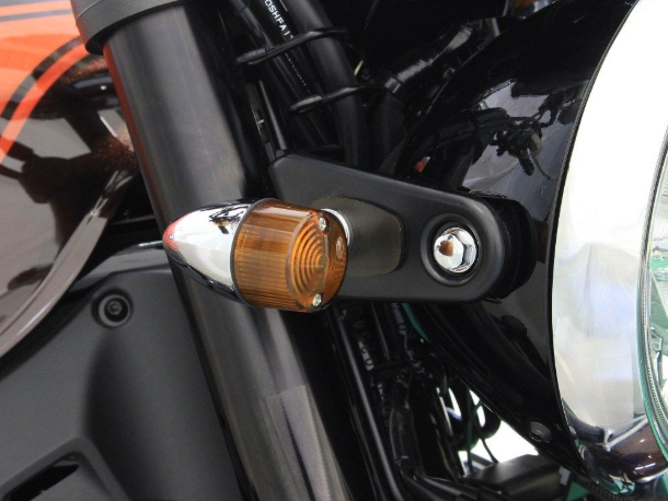 Close-up of a motorcycle turn signal and headlight