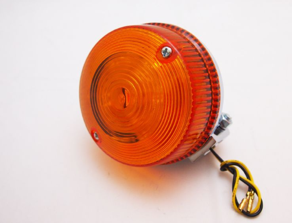 Orange warning light with wiring on a white background