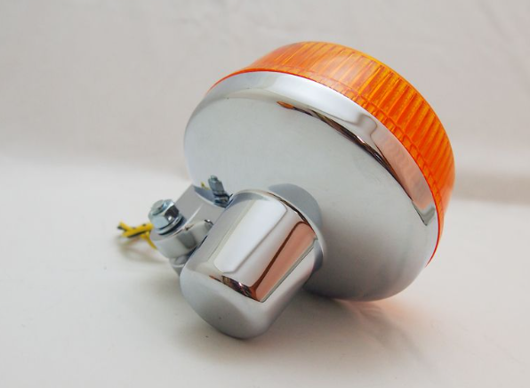 Orange and silver warning light on a white background