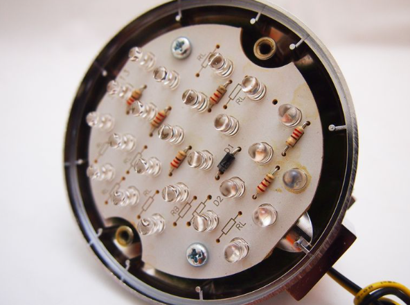 Close-up of an electronic circuit board with components on a white background