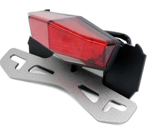 Red bike tail light with metal bracket on a white background
