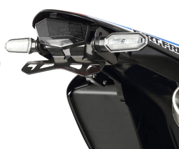Close-up of a motorcycle's rearview mirror and license plate area with 'KTM' branding.
