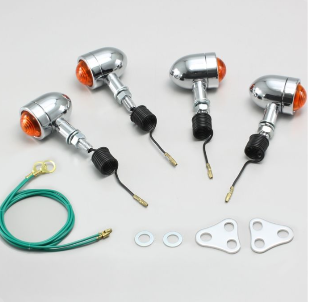 Set of motorcycle turn signals with wiring and mounting hardware on a light gray background