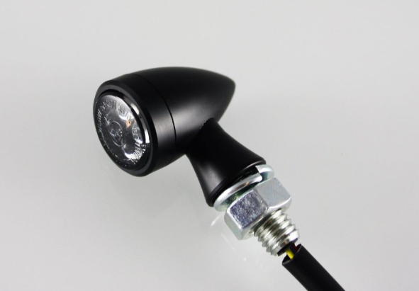 Black motorcycle light on a gray background