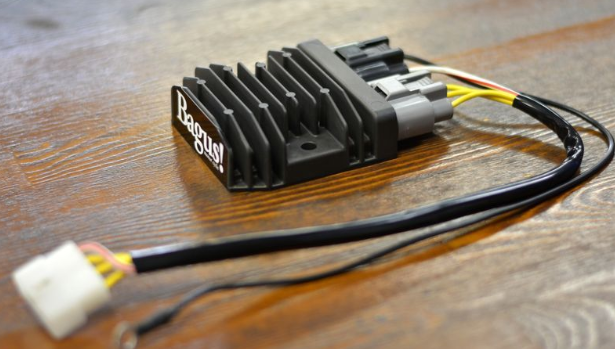 Black electronic component with 'Baggs' branding on a wooden surface