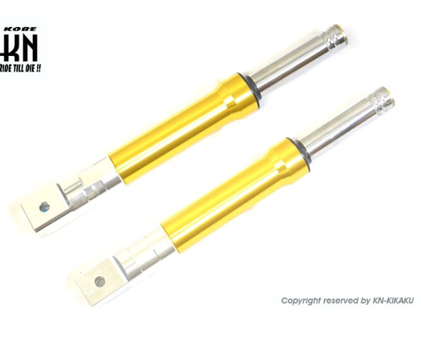 Yellow shock absorbers with silver ends on a white background, featuring the Kikaku brand.