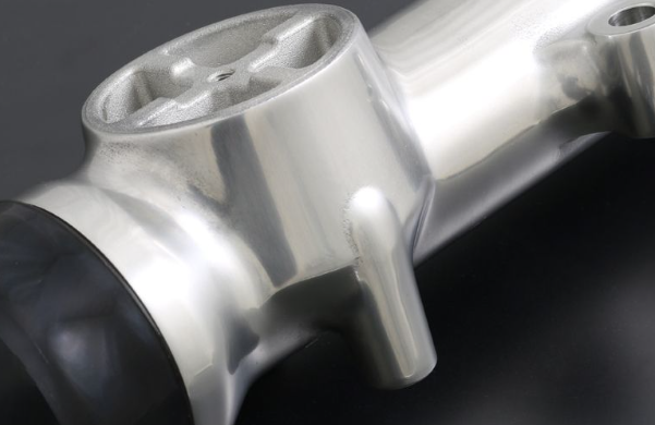 Close-up of a metallic mechanical component on a dark background