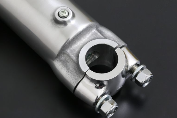 Close-up of a metallic mechanical component on a dark background