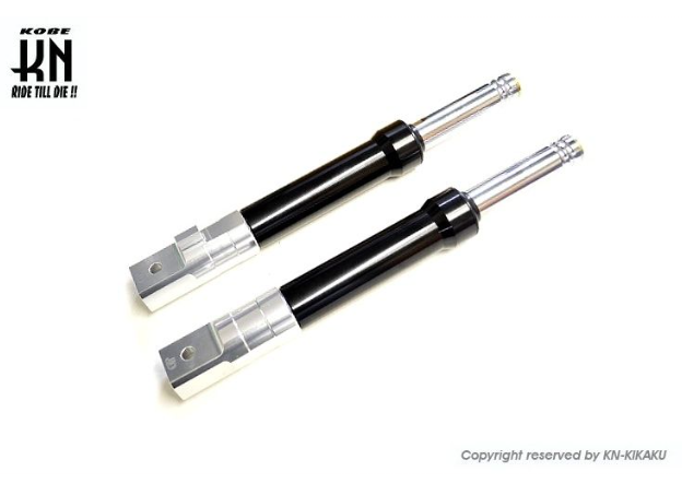 Two shock absorbers on a white background with K&N logo.