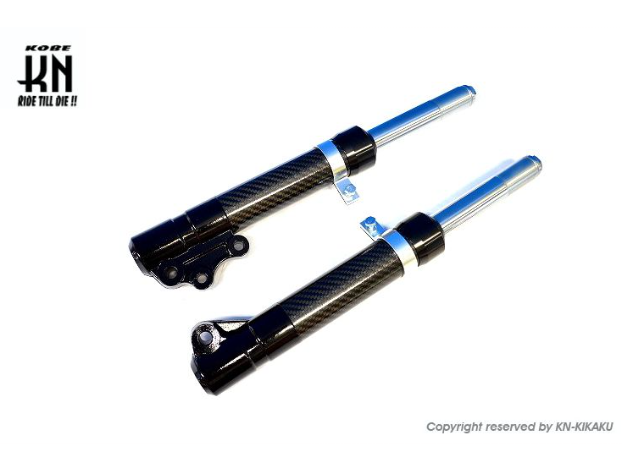 Two black motorcycle shock absorbers with blue accents on a white background, featuring the brand 'KN'.