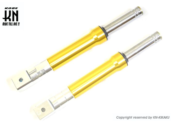 Yellow shock absorbers with silver ends on a white background, featuring KIKAKU branding.