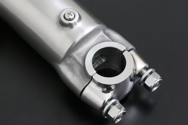 Close-up of a metallic mechanical component on a dark background