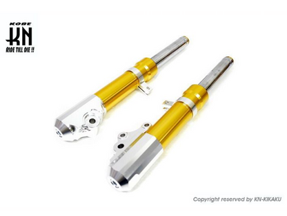 Two yellow motorcycle shock absorbers on a white background with K&N logo.