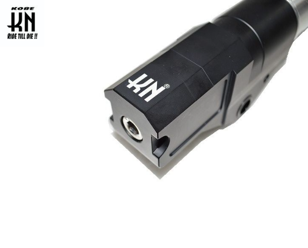 Close-up of a black and silver KN branded product on a white background