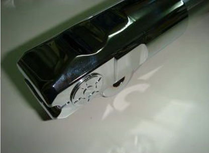 Chrome handle on a white surface