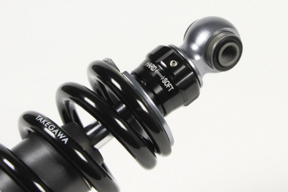 Black shock absorber with 'Yakima' branding on a white background