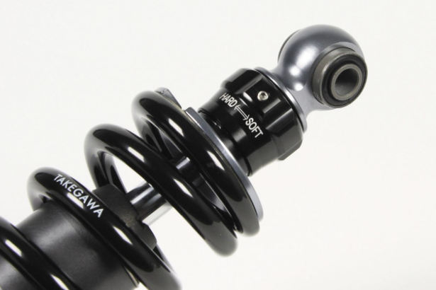 Black shock absorber with 'Yakima' branding on a white background