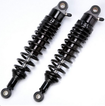 Two black shock absorbers on a white background