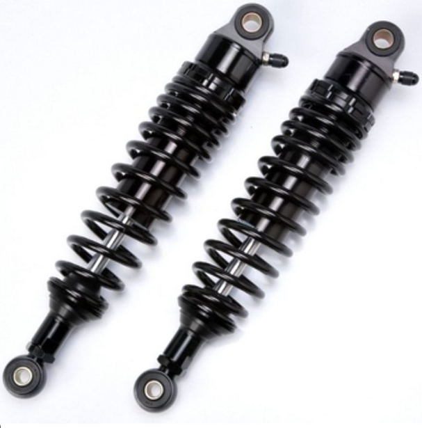Two black shock absorbers on a white background